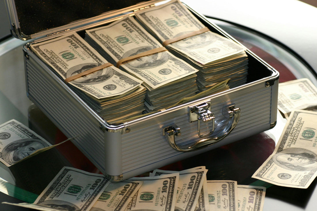 wads of cash inside a briefcase