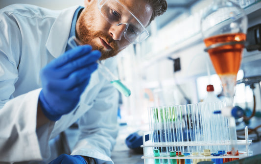 Chemist handling a tube in a lab
